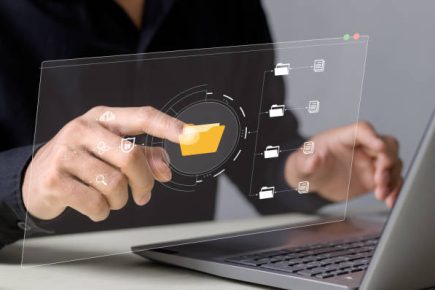 businessman typing on virtual screen, document management system online documentation database and process automation to efficiently manage files, knowledge and documentation in enterprise.